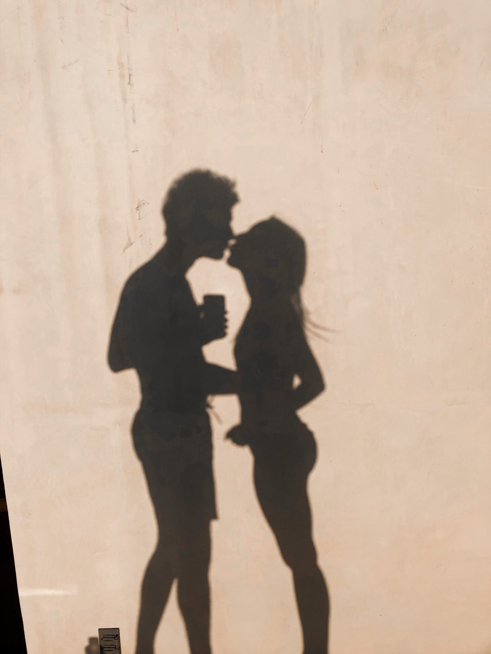 girl and boy shadow kissing